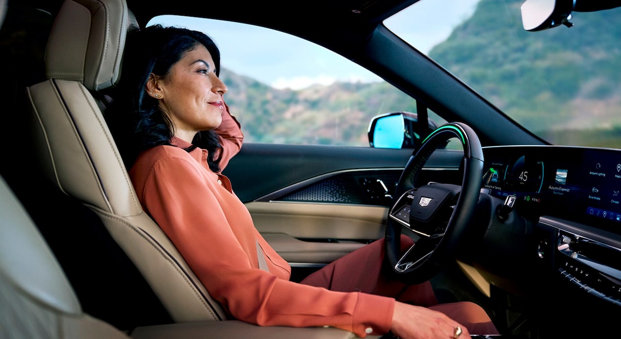 A woman sitting in the driver's seat
