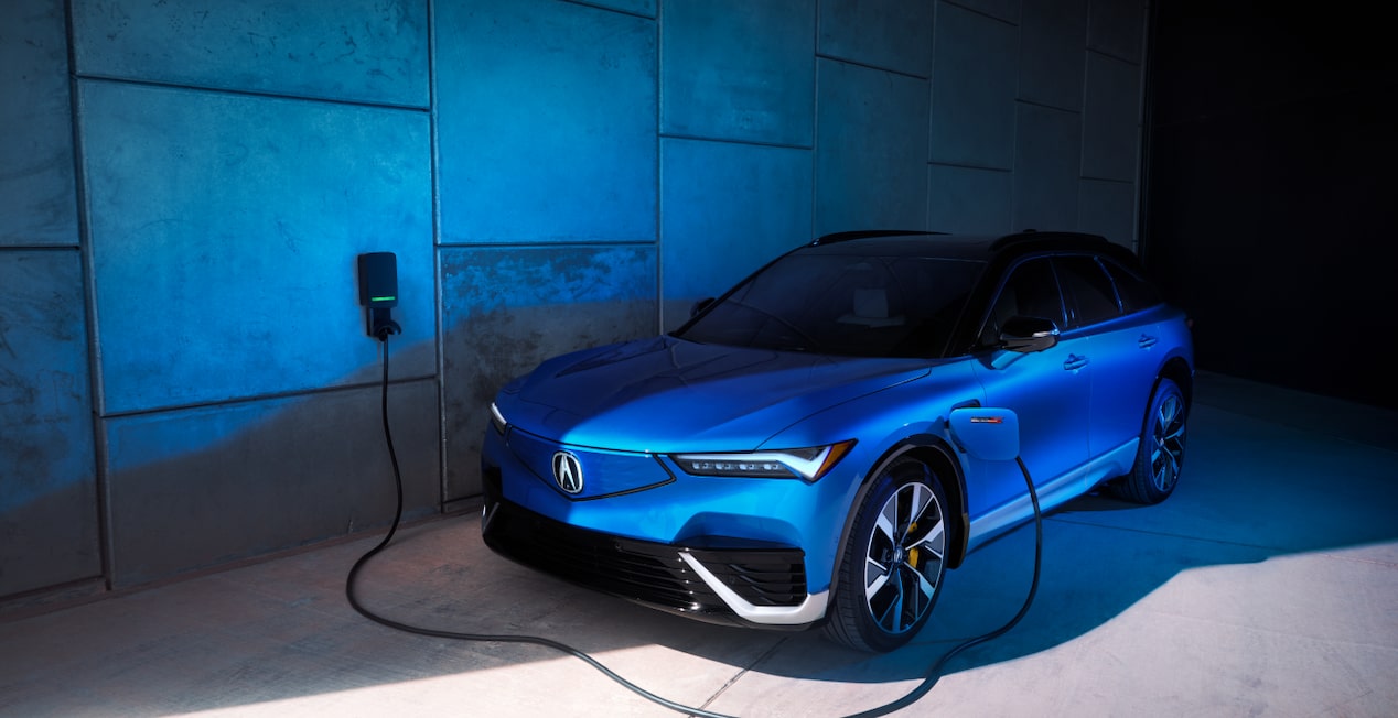 Blue Acura EV vehicle charging 