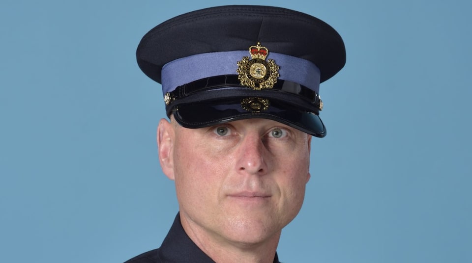 A police dog running Provincial Constable Keith Lindley