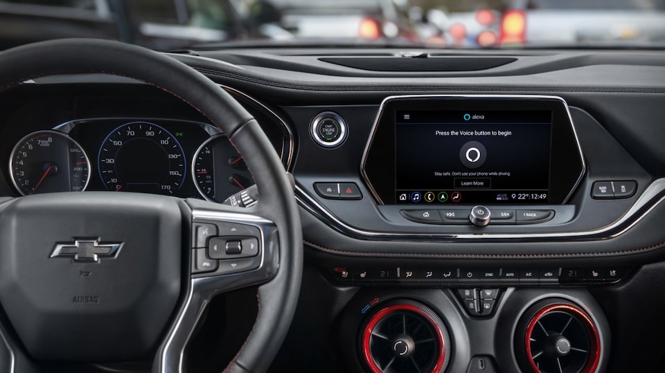 Close up of Steering Wheel & Infotainment System featuring Alexa.