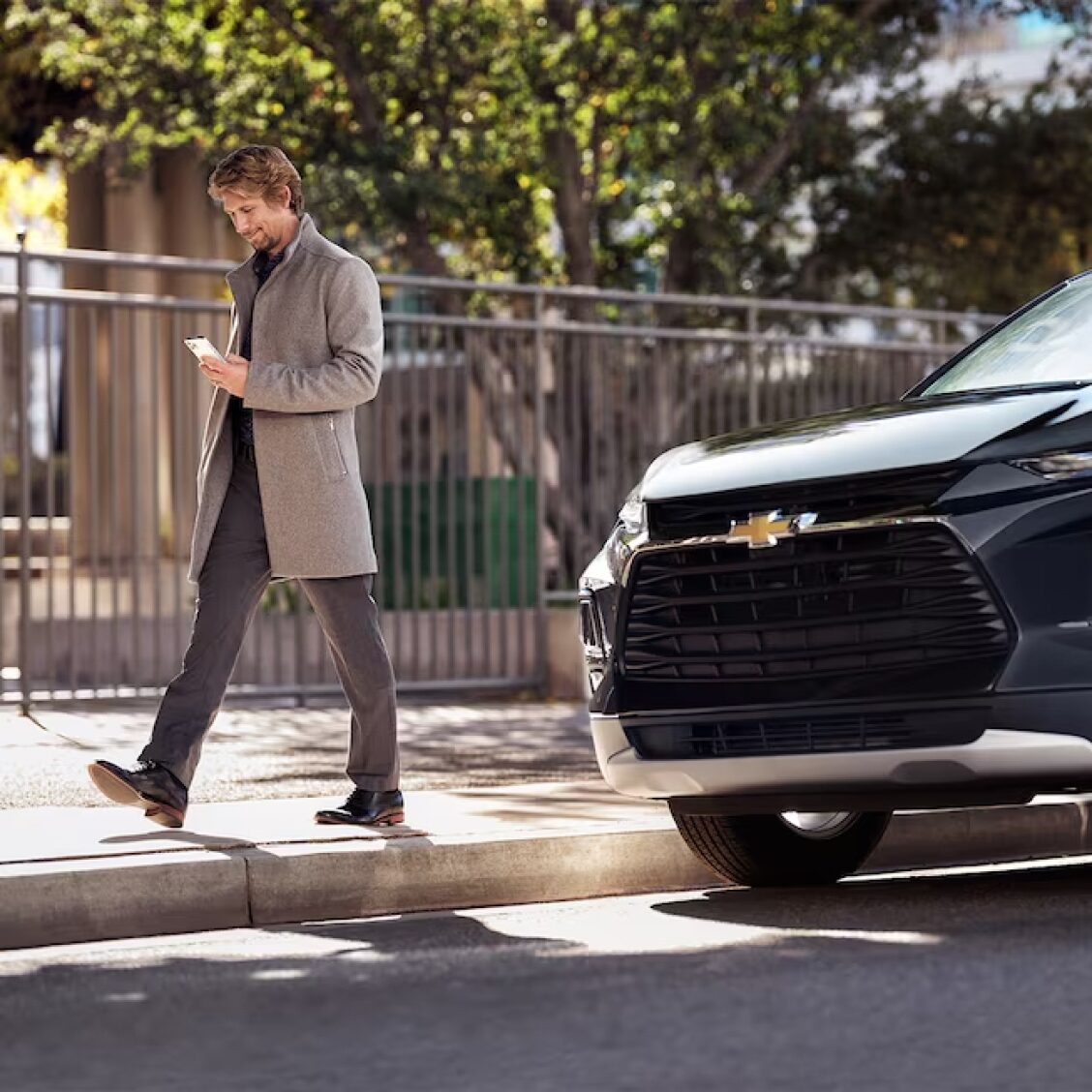 Man Using the OnStar Vehicle Location Map Feature.
