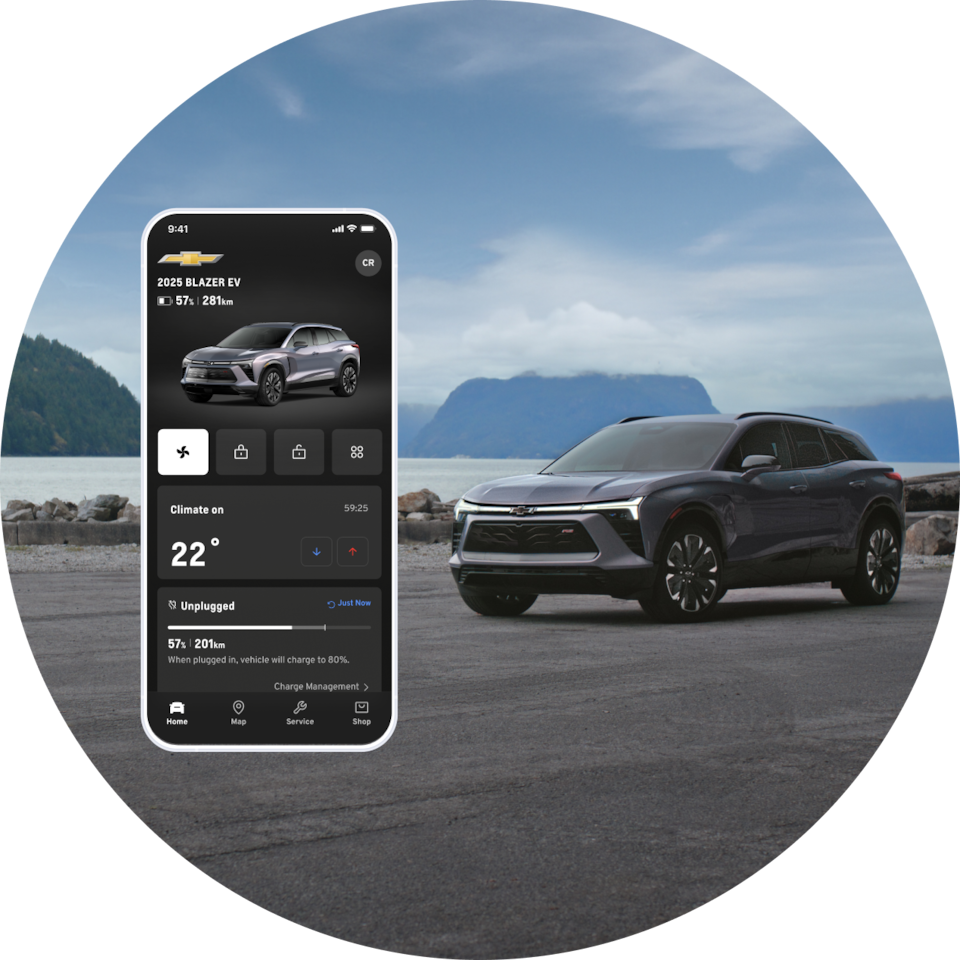 A smartphone displaying the mobile app with remote vehicle controls with a grey Chevrolet  in the background of an outdoor setting.