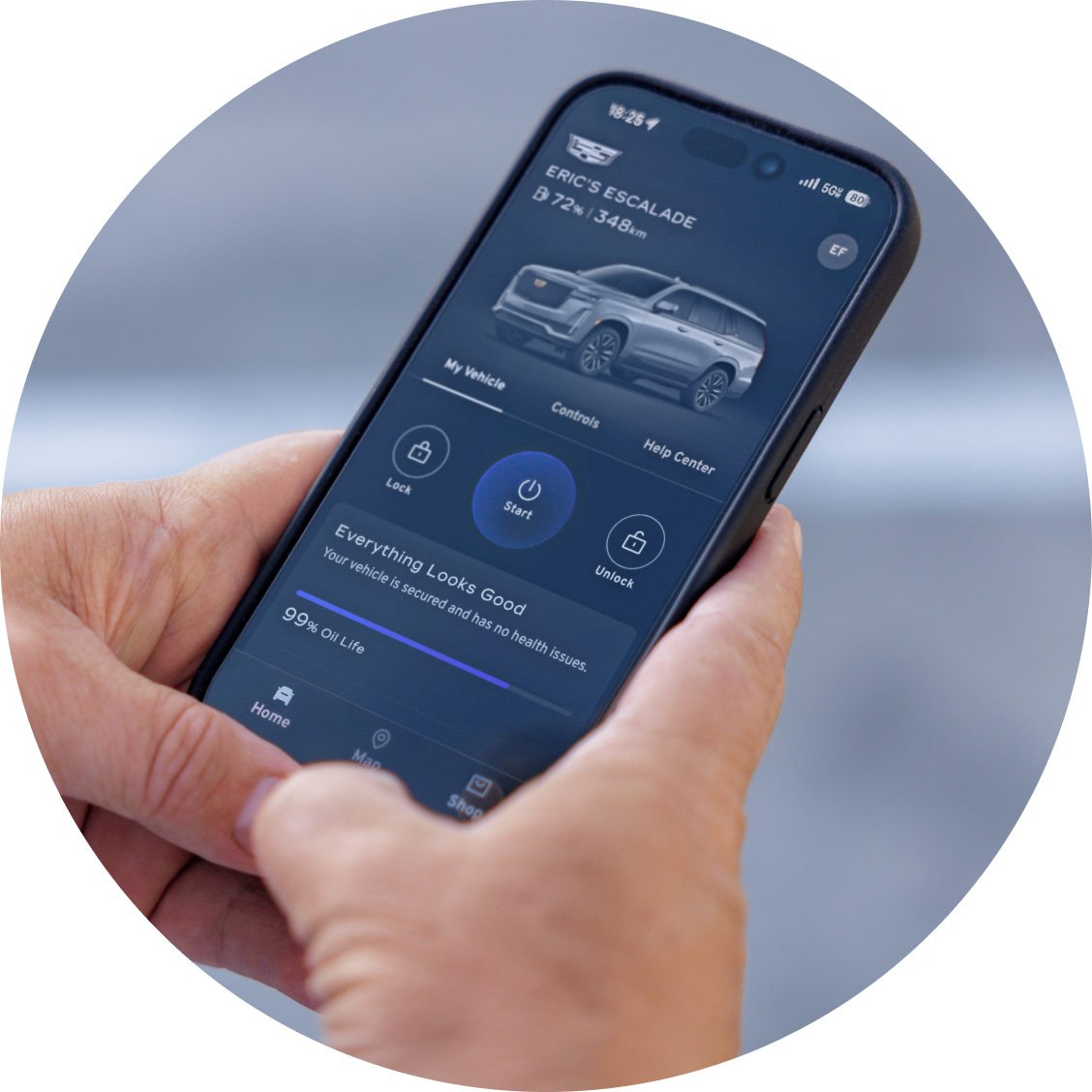 A person's hands using the OnStar app on a smartphone.