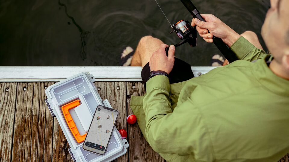 A person confidently going fishing in the summer thanks to OnStar's safety services.