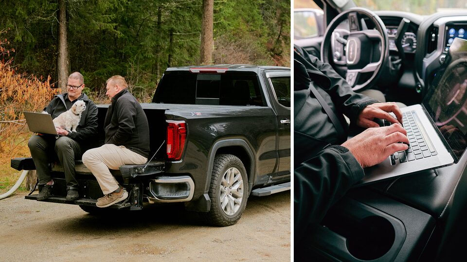 Andre Chocquette working on a laptop in his GMC Sierra 1500.